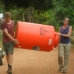 Eco warriors carrying up the water tank.