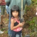 Local children helping to plan trees.